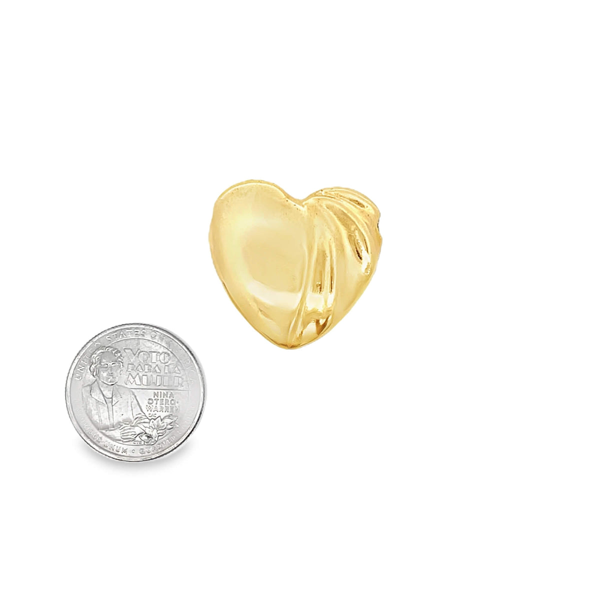 A glossy gold puffy heart charm rests next to a US quarter coin to show scale.