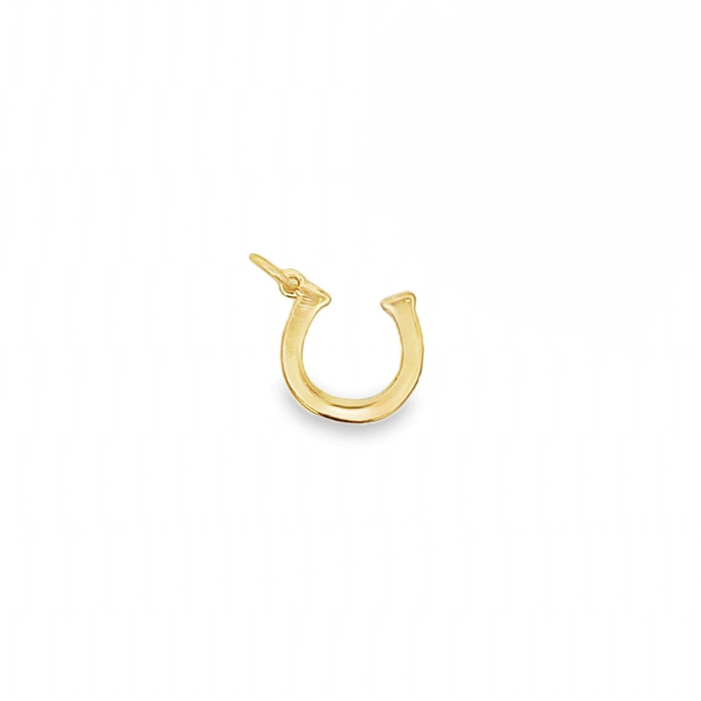 A polished gold horseshoe charm sits upright against a plain white background.