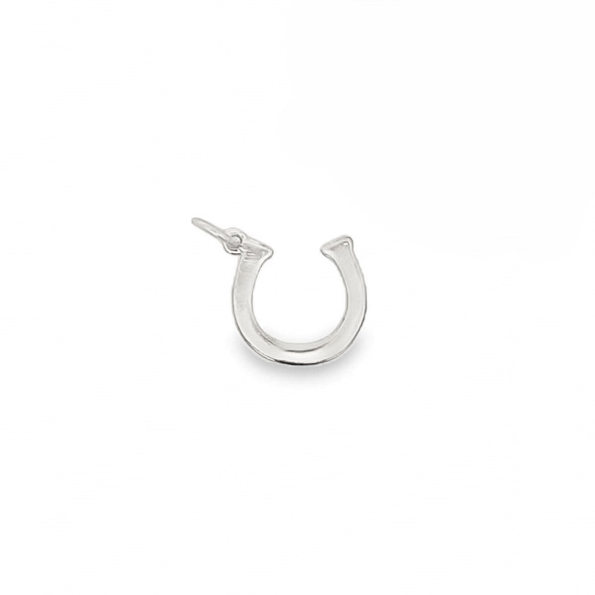 A polished sterling silver horseshoe charm rests against a clean white background.