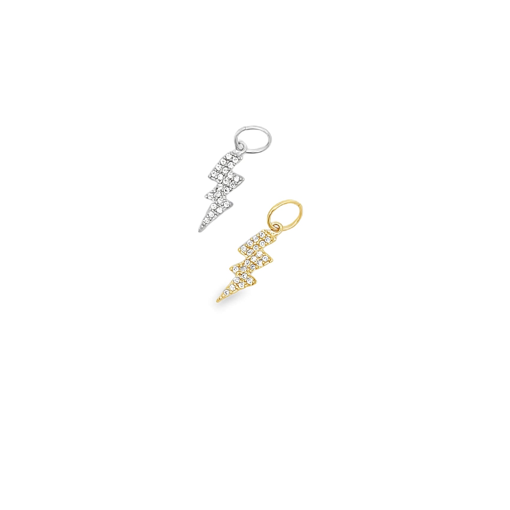 Two pavé diamond lightning bolt charms, one in silver and one in gold, sparkle against a plain white background.