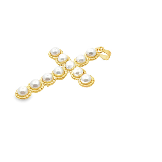 A delicate gold cross pendant features embedded white pearls along its textured metal frame against a clean white background.