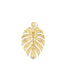 A shiny gold monstera leaf pendant gleams against a clean white background.