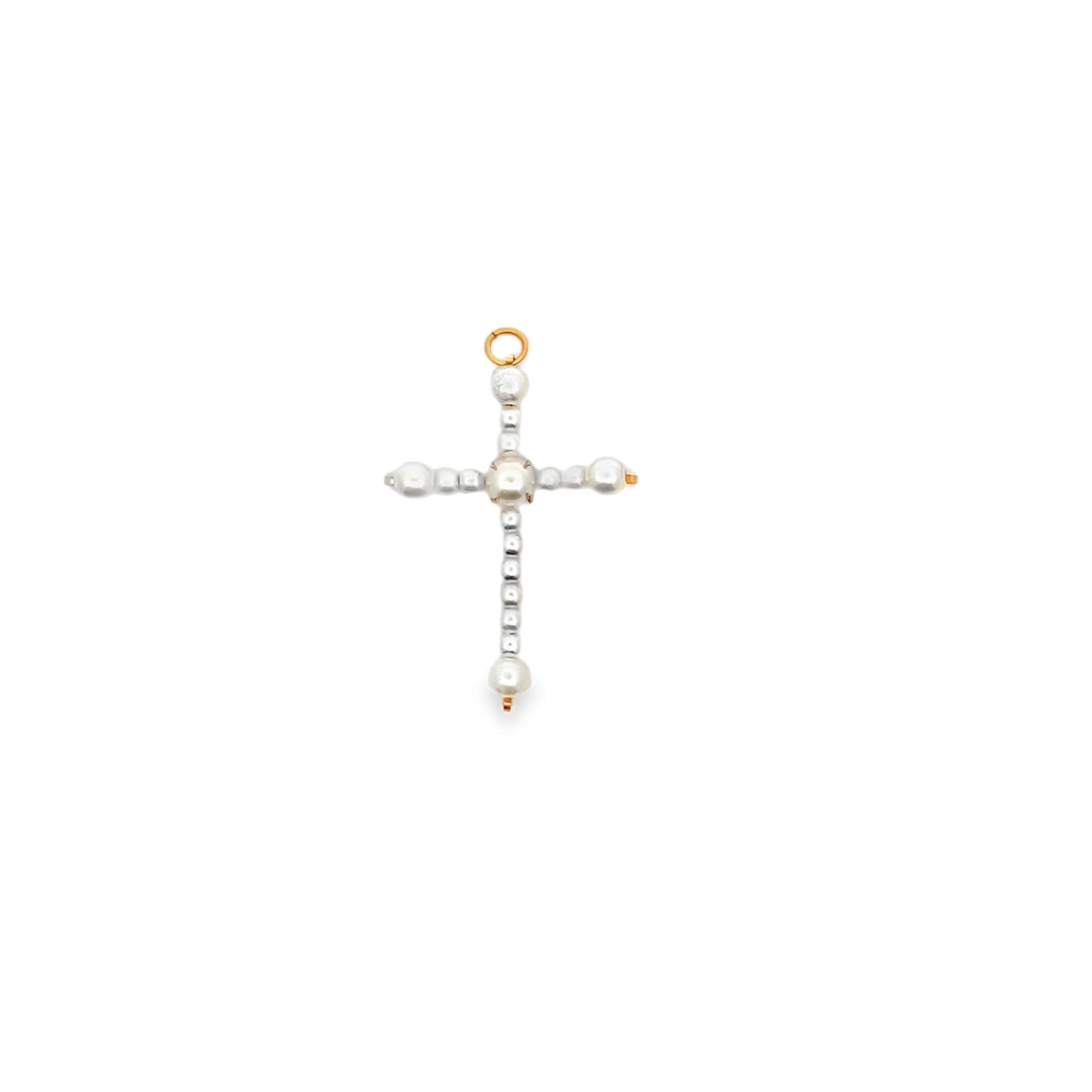 A delicate gold cross pendant features an arrangement of lustrous white freshwater pearls.