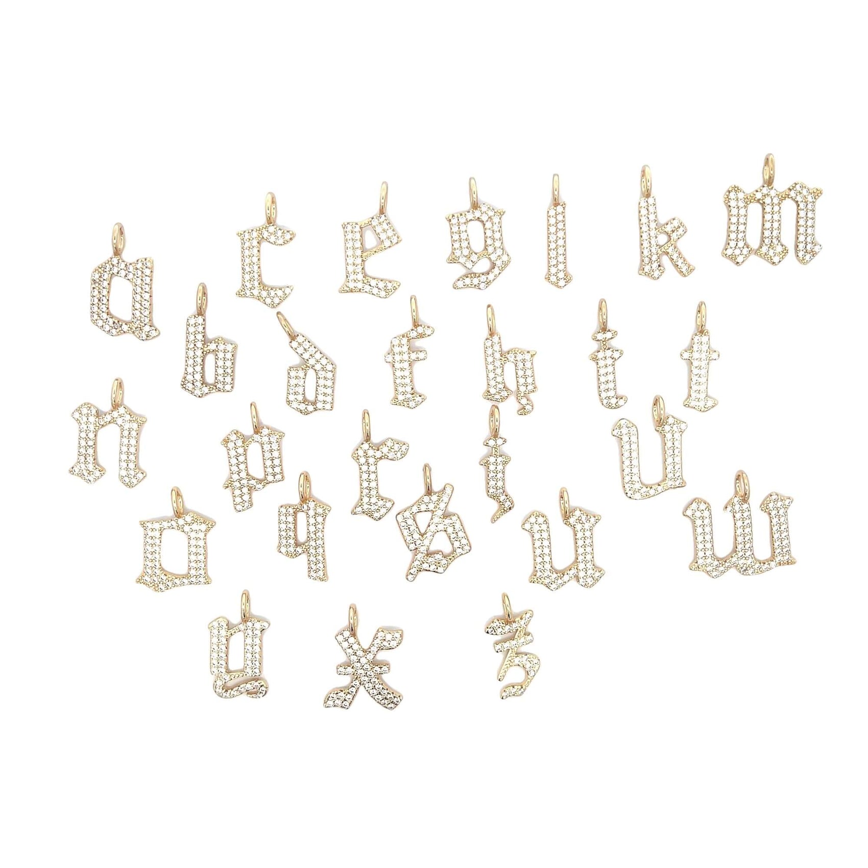A collection of gold-colored CZ pave initial monogram letter pendant charms displayed on a white background.
