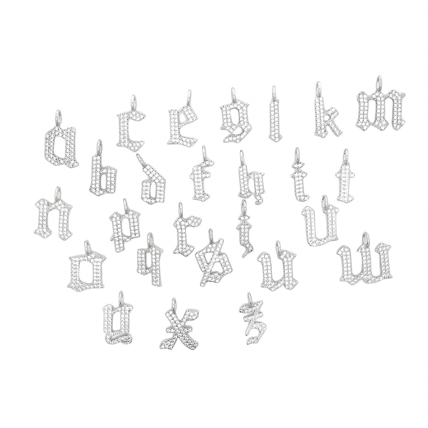 A collection of sparkling diamond-encrusted lowercase letter charms in a Gothic font layout on a white background.