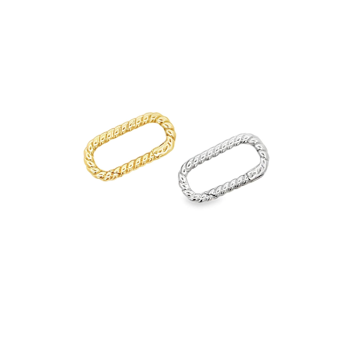 Two twisted rectangular carabiner charm connectors lie side by side, one in gold and the other in silver.