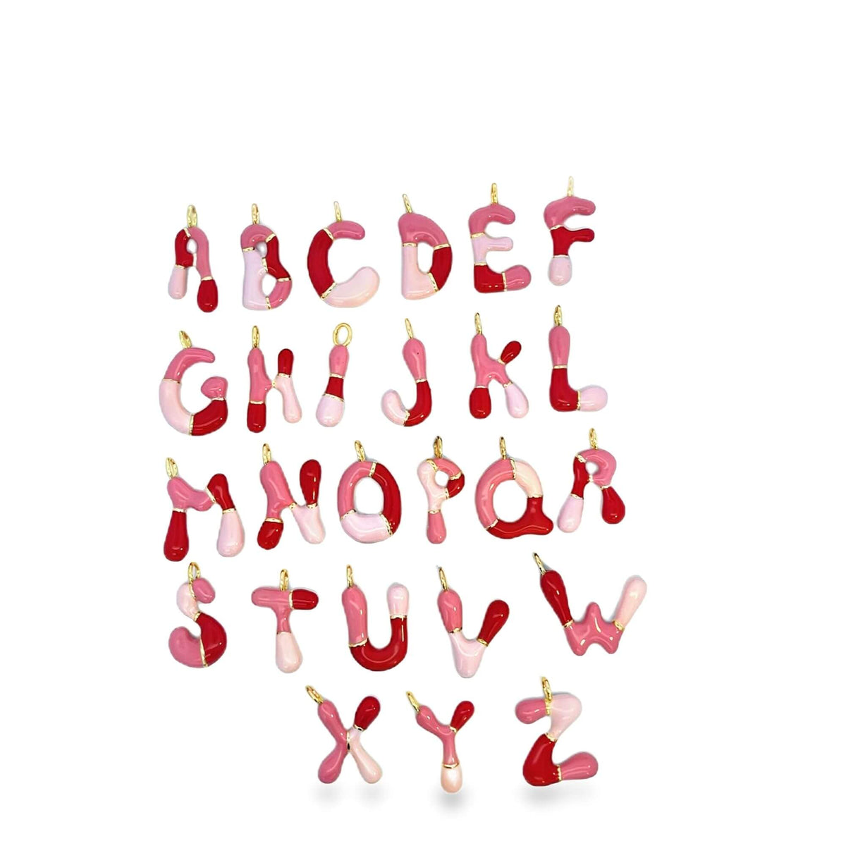 A complete set of colorful enamel alphabet letter charms featuring shades of pink and red hangs neatly against a white background.