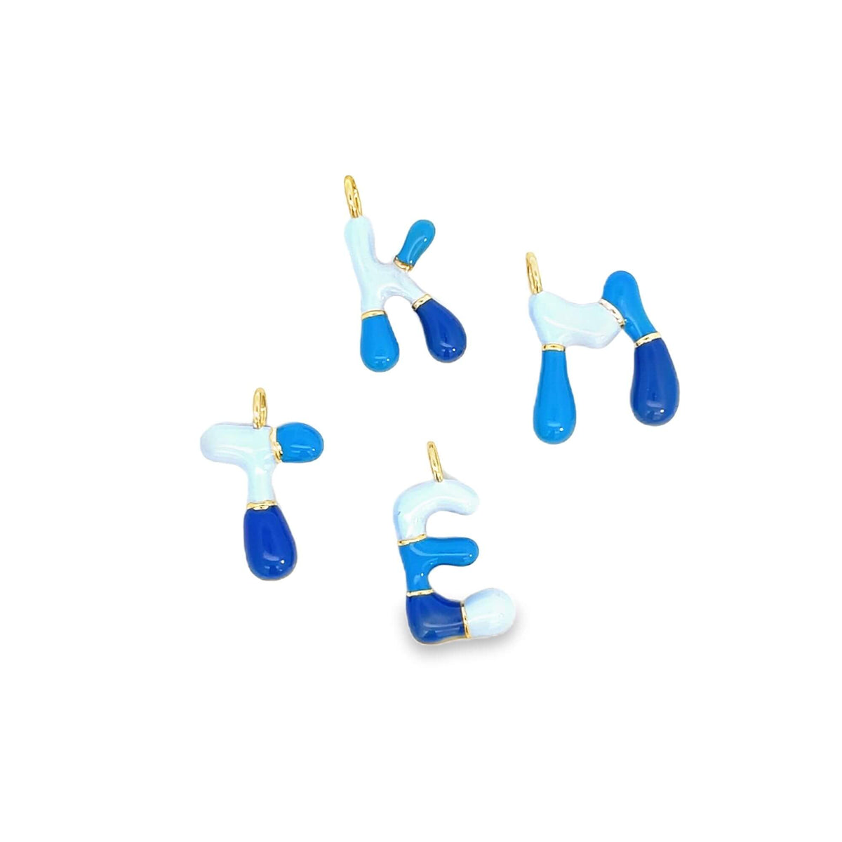 Four blue-and-white enamel letter charms dangle against a white background, featuring gold loops for jewelry making.