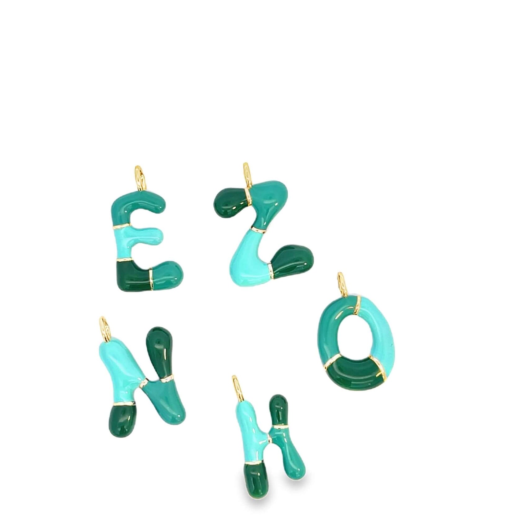 Colorful enamel alphabet letter charms in shades of green and turquoise display golden accents against a clean white background.