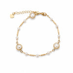 Elegant 18K gold filled piece with pearls set in a bezel, delicate pearls, and gold bar details. Lightweight, timeless, and perfect for everyday wear.