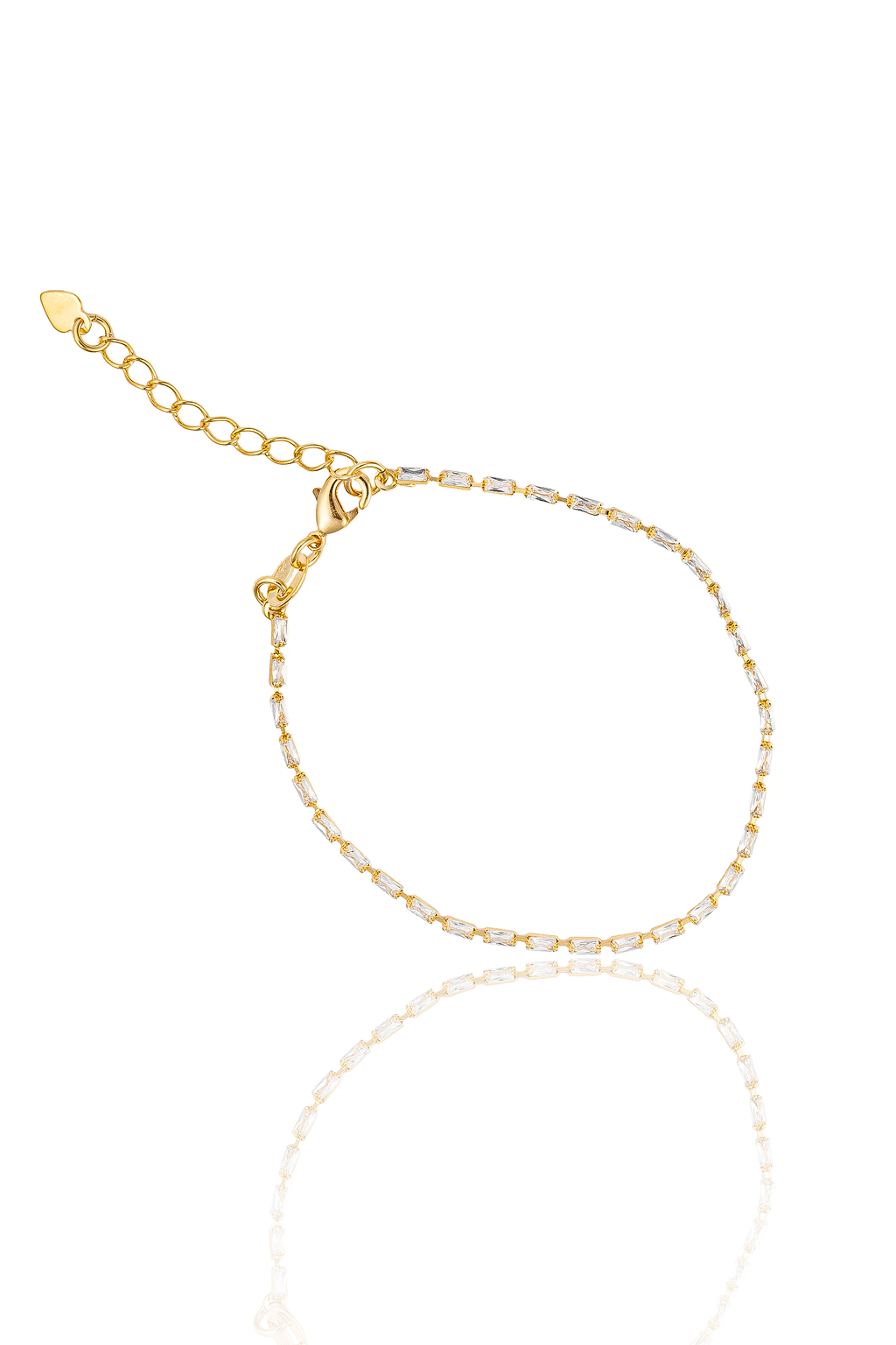 A delicate gold tennis bracelet sparkles with rectangular cubic zirconia stones against a clean white background.