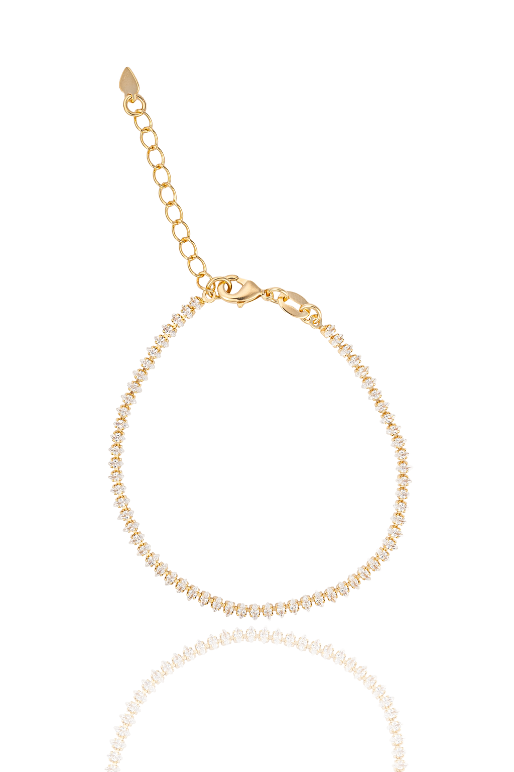 A delicate gold tennis bracelet sparkles with cubic zirconia stones against a clean white background.