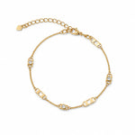 Elegant 18K Gold Filled station necklace featuring geometric open-link accents and bezel-set cubic zirconia. Lightweight, modern and perfect for layering.