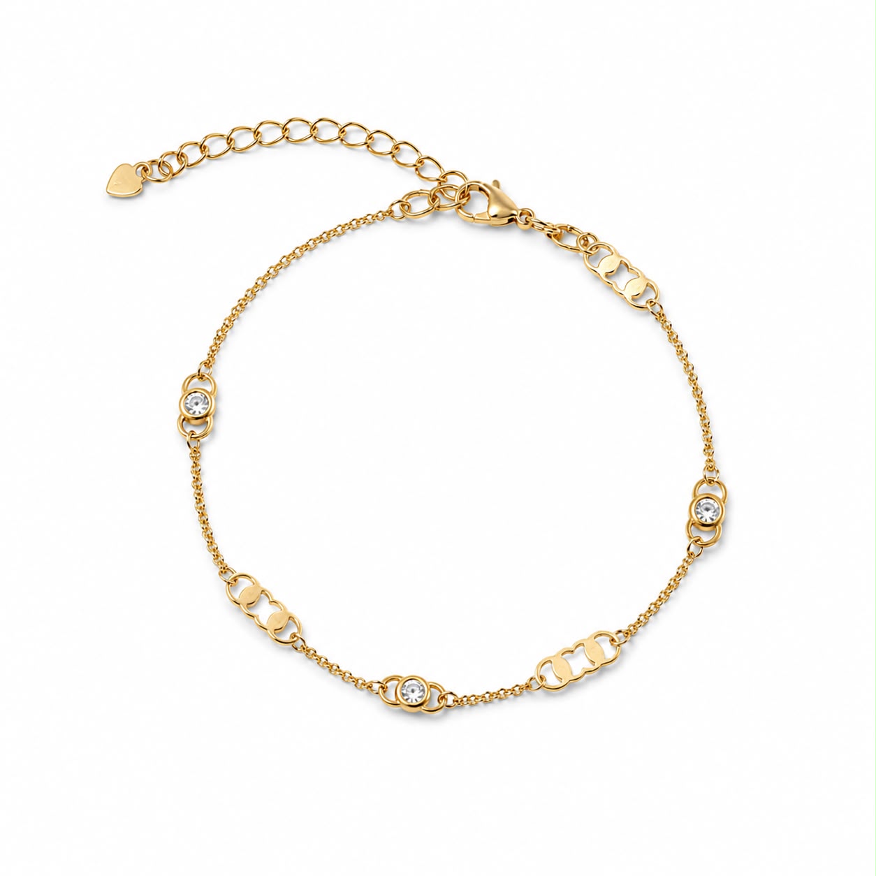 A delicate gold chain bracelet features sparkling crystal bezels and decorative links against a clean white background.