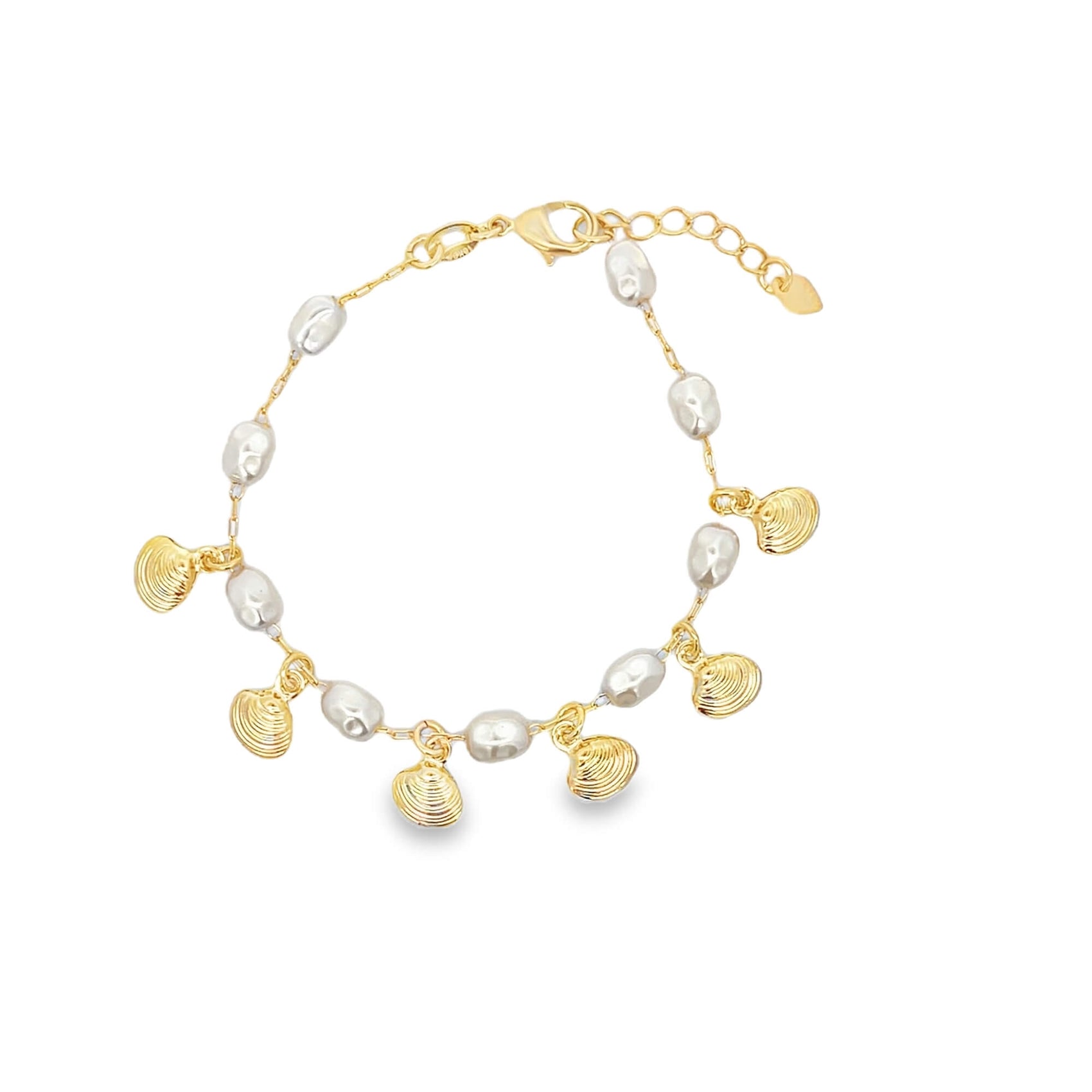 A delicate gold chain bracelet features alternating baroque pearls and dangling seashell charms.