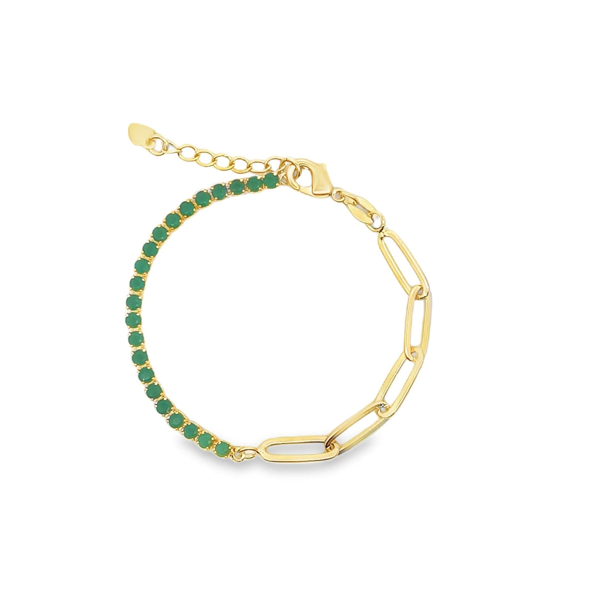 A gold link and emerald tennis bracelet sparkles against a white background.