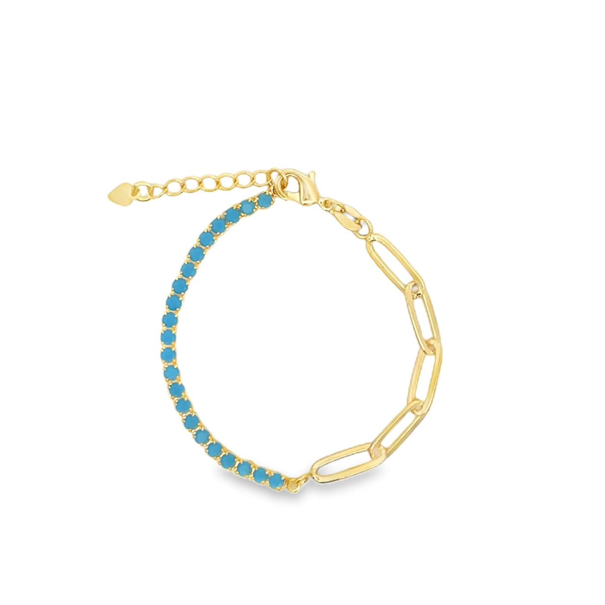 A gold half-paperclip and half-turquoise tennis chain bracelet rests against a plain white background.
