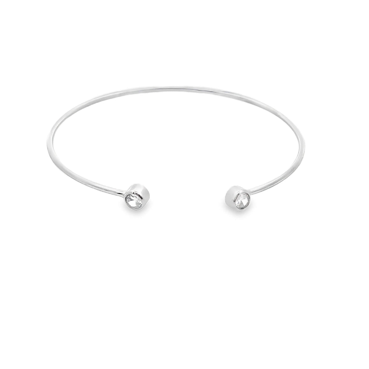 A sleek silver cuff bracelet features sparkling stone accents on each open end against a clean white background.