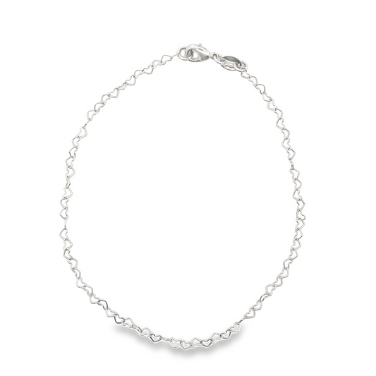 A delicate silver heart-link chain bracelet rests on a clean white surface, showcasing its interconnected miniature heart design and secure lobster clasp.