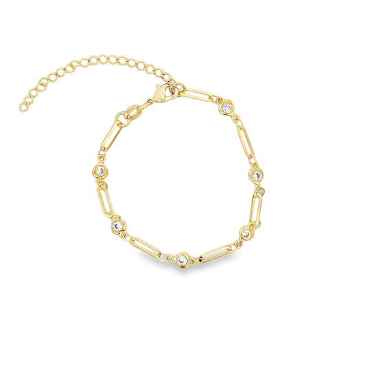 A delicate gold paperclip link bracelet features alternating bezel-set cubic zirconia stones and an adjustable extender chain against a clean white background.
