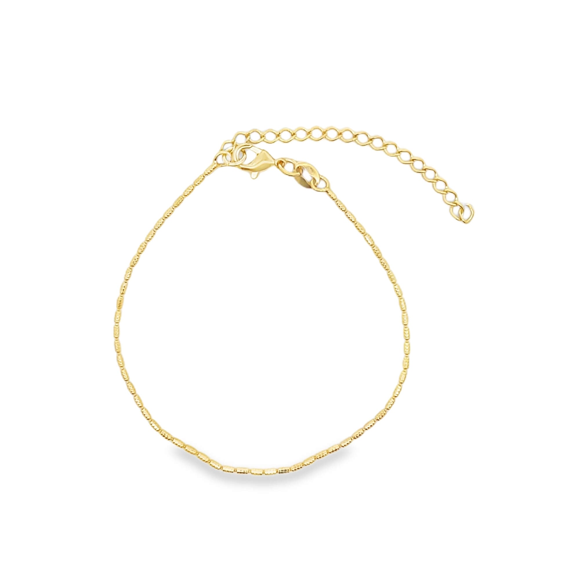 Gold bracelet on a white background