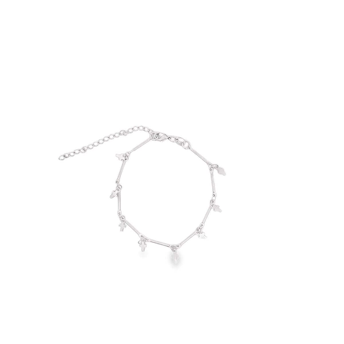A delicate silver charm bracelet featuring multiple tiny cross charms dangles against a plain white background.