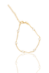 A delicate gold-plated bracelet features spaced white heart-shaped pearls and an adjustable chain clasp against a clean white background.