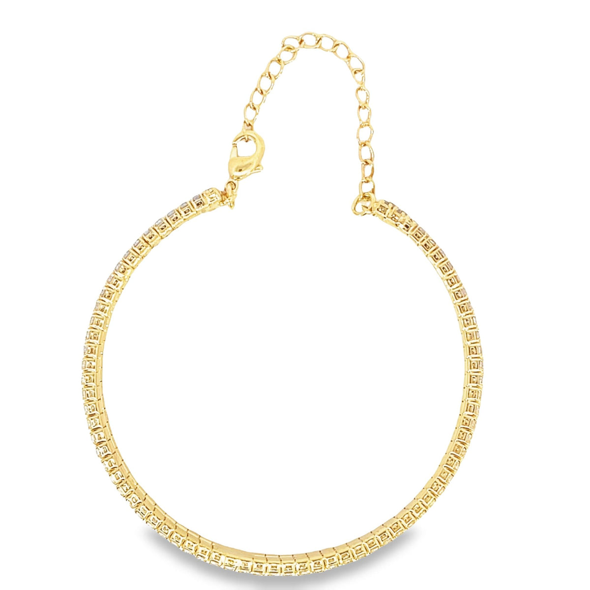 A gold tennis bracelet sparkles against a white background, featuring an adjustable chain and a lobster clasp.