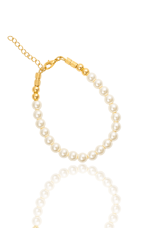 An elegant faux pearl bracelet features gold-tone accents and an adjustable chain clasp against a white background.