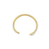 A delicate gold cuff bracelet features an open-circle design lined with tiny white pearls.