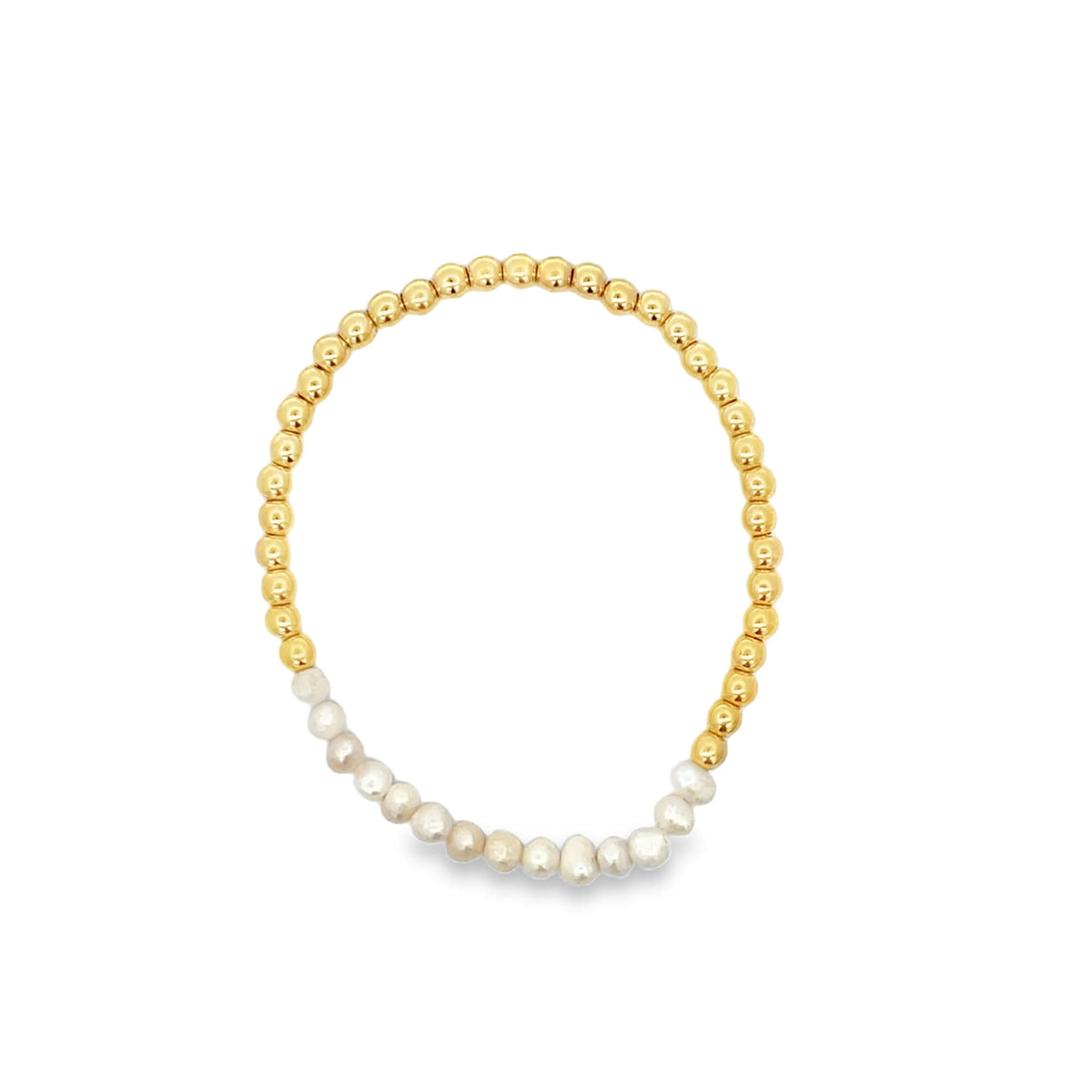 Gold and pearl beaded bracelet on a white background
