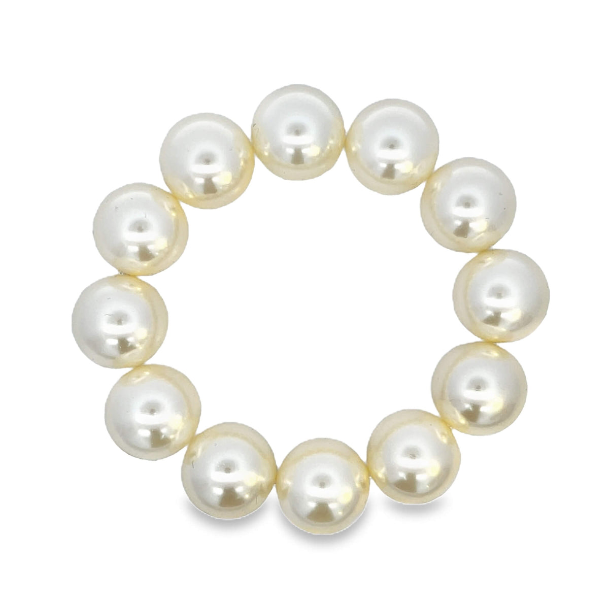 A circle of luminous white pearls forms a delicate beaded bracelet against a clean white background.