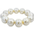 A circular white faux pearl bracelet rests against a clean white background.