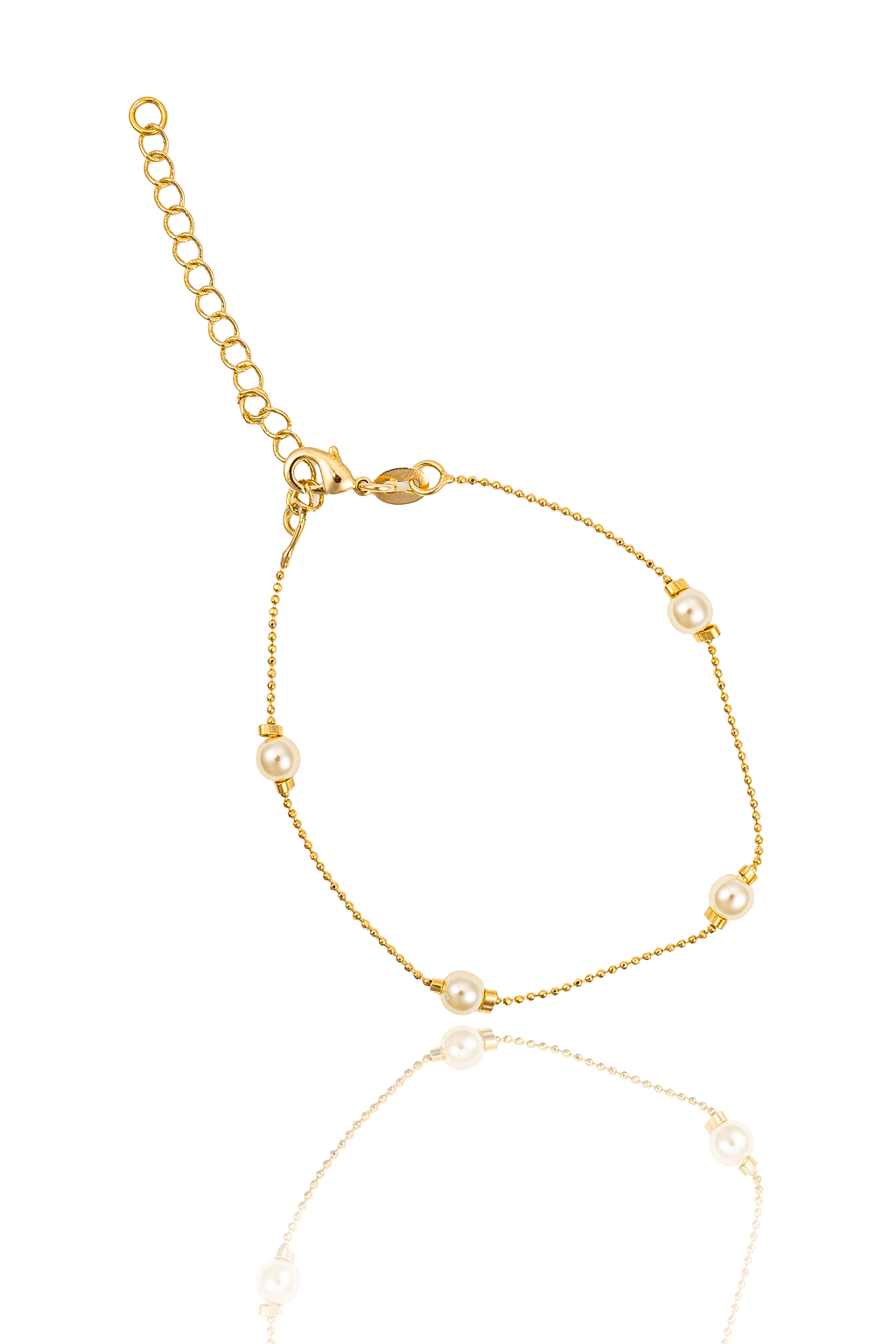 A delicate gold chain bracelet features interspersed pearls and an adjustable extension chain against a white background.