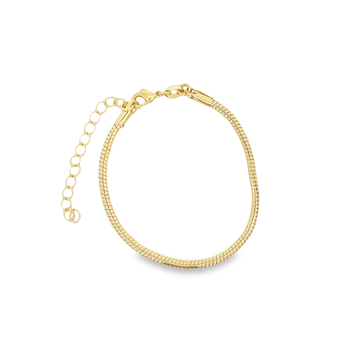 A delicate gold snake chain bracelet rests against a white background, highlighting its smooth texture and adjustable clasp.