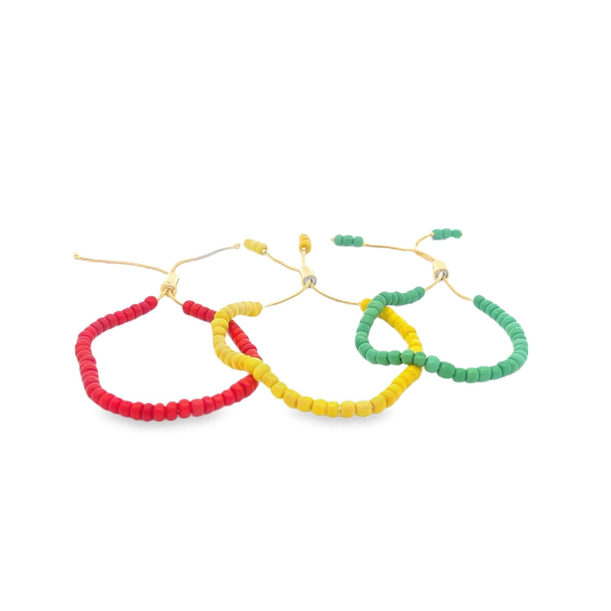 Three adjustable beaded bracelets featuring red, yellow, and green colors lie intertwined on a white background.