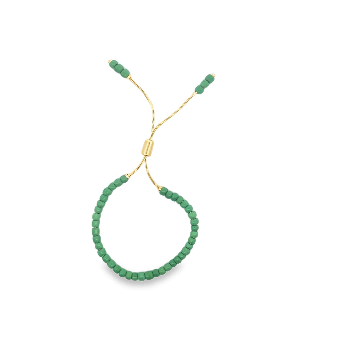 An adjustable green beaded slider bracelet with delicate gold chains rests against a clean white background.
