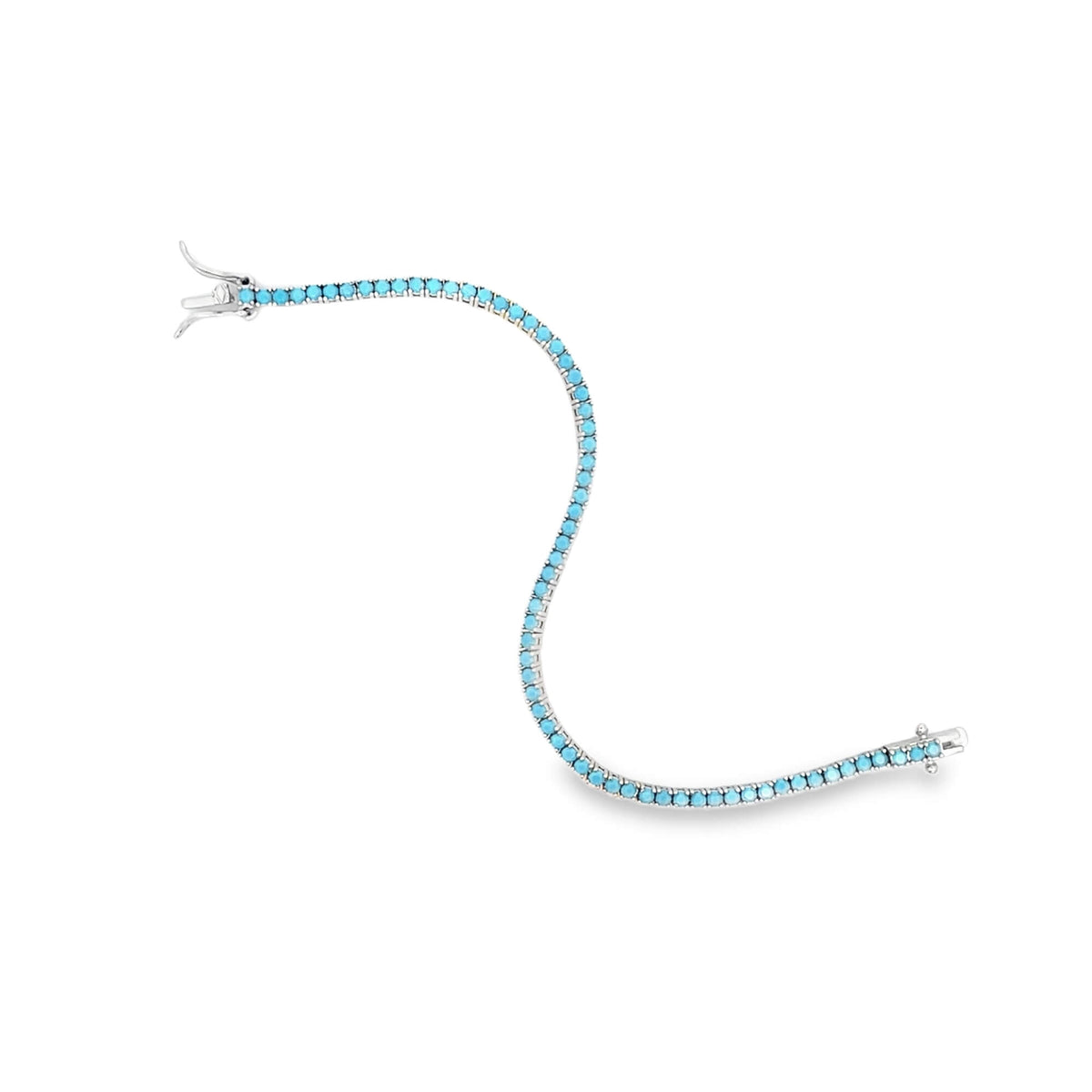 A silver tennis bracelet glistens against a white background, featuring a continuous line of vibrant turquoise stones.