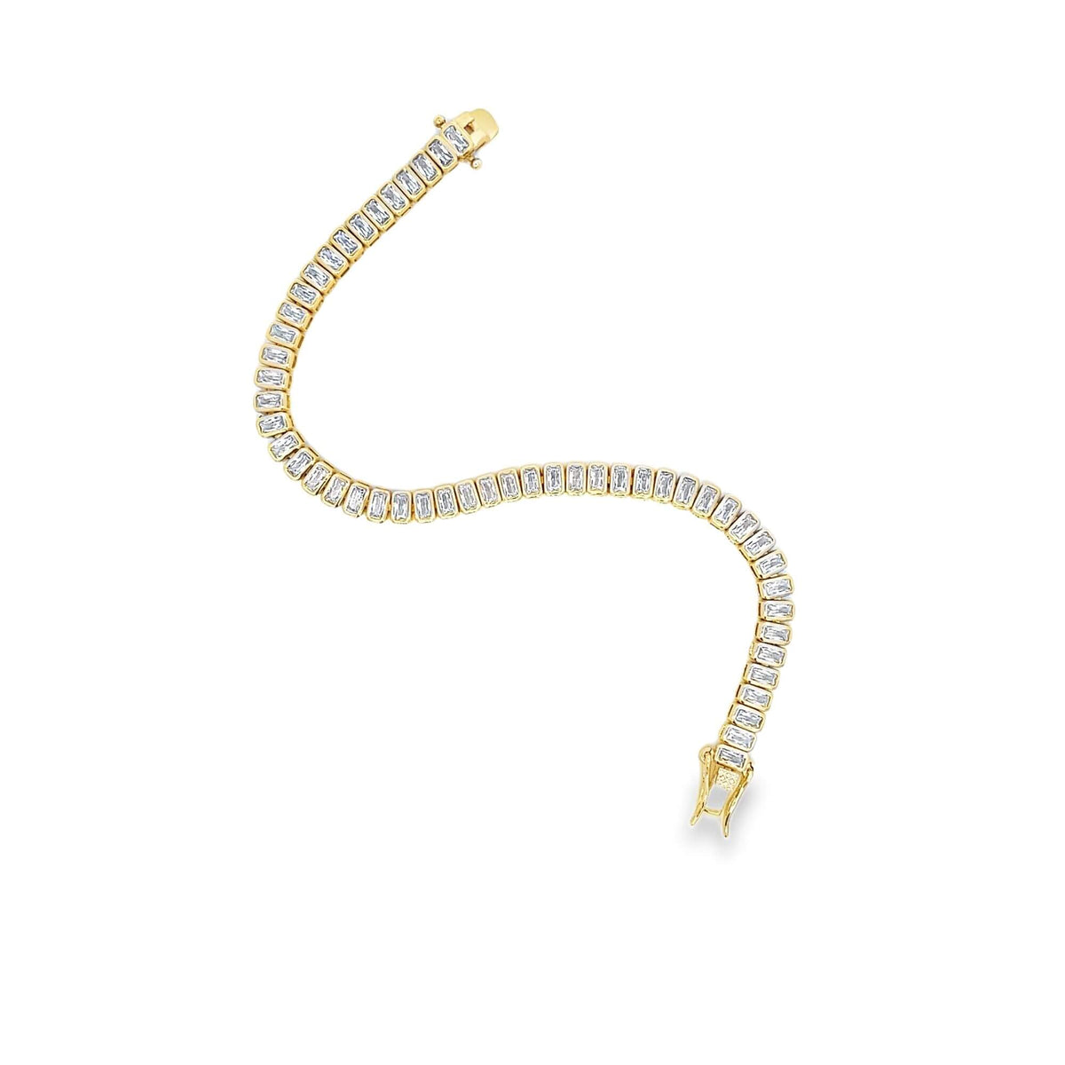 A gold tennis bracelet curves gracefully, showcasing a continuous line of sparkling baguette-cut diamonds against a clean white background.
