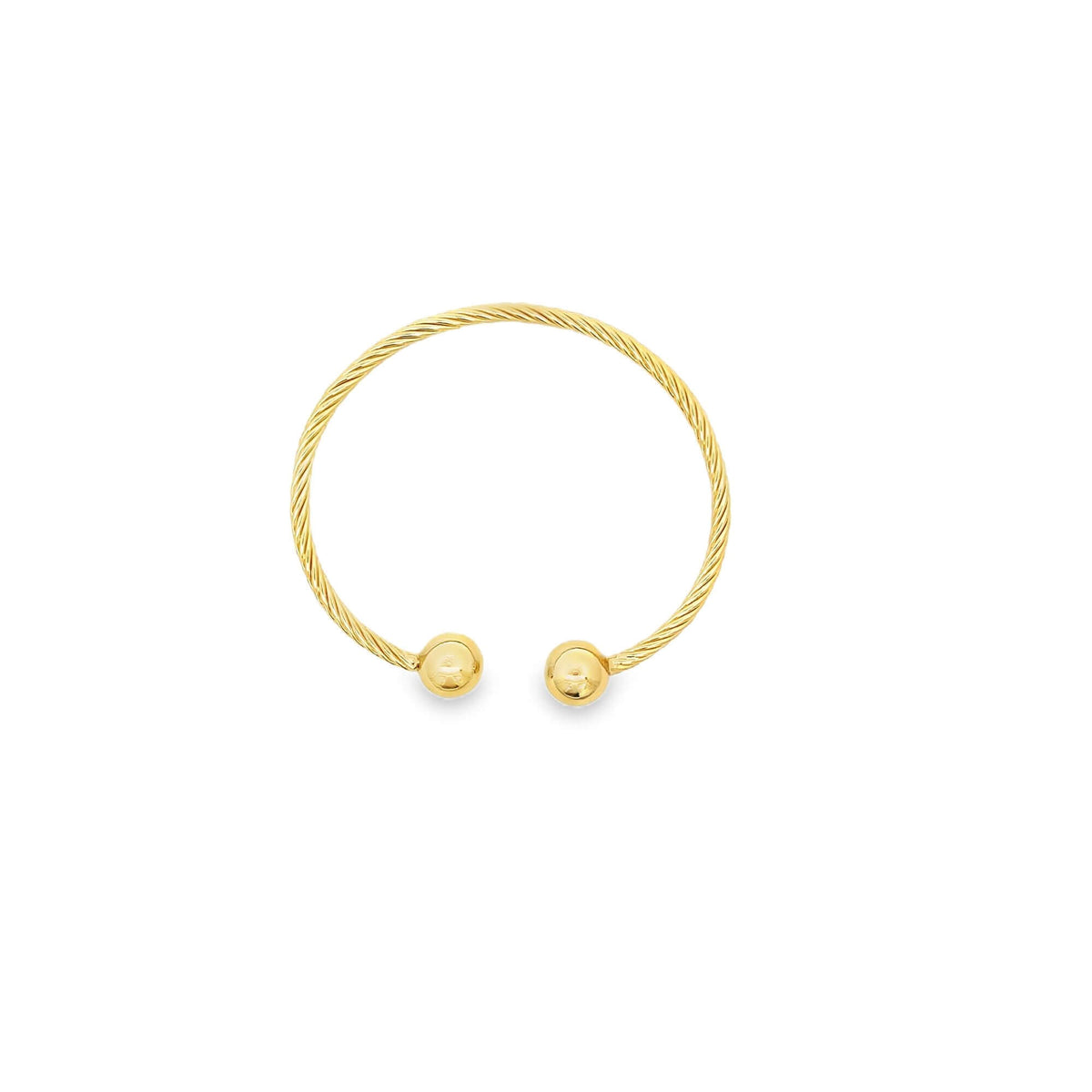 A gold cable-wire cuff bracelet features polished ball terminals at each open end against a white background.