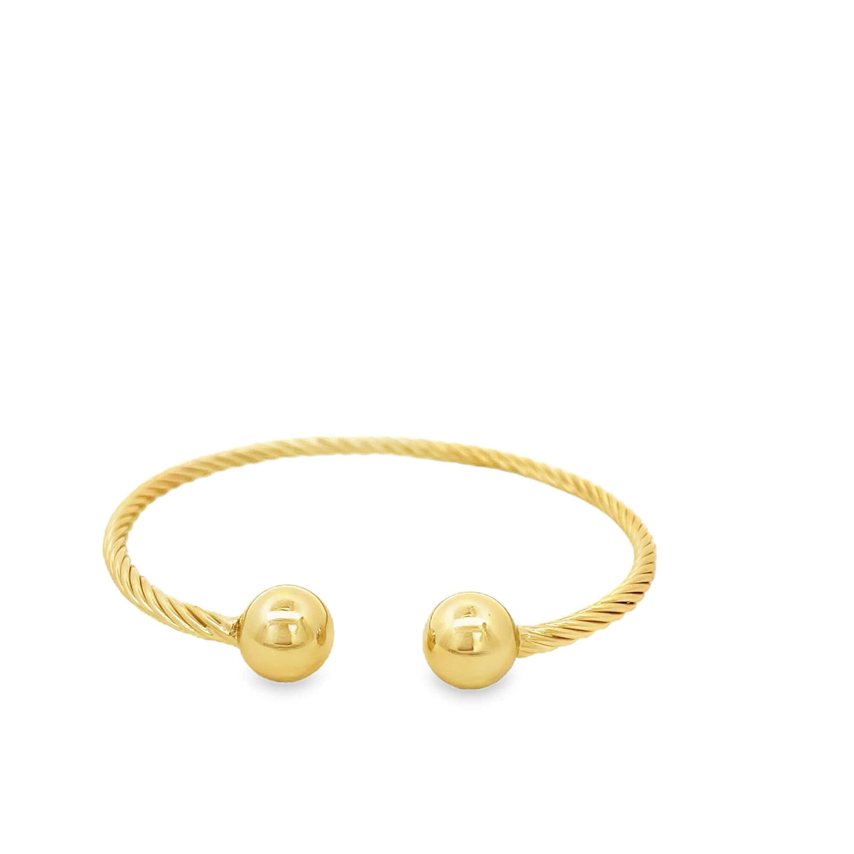A gold cable wire cuff bracelet features polished sphere ends against a clean white background.
