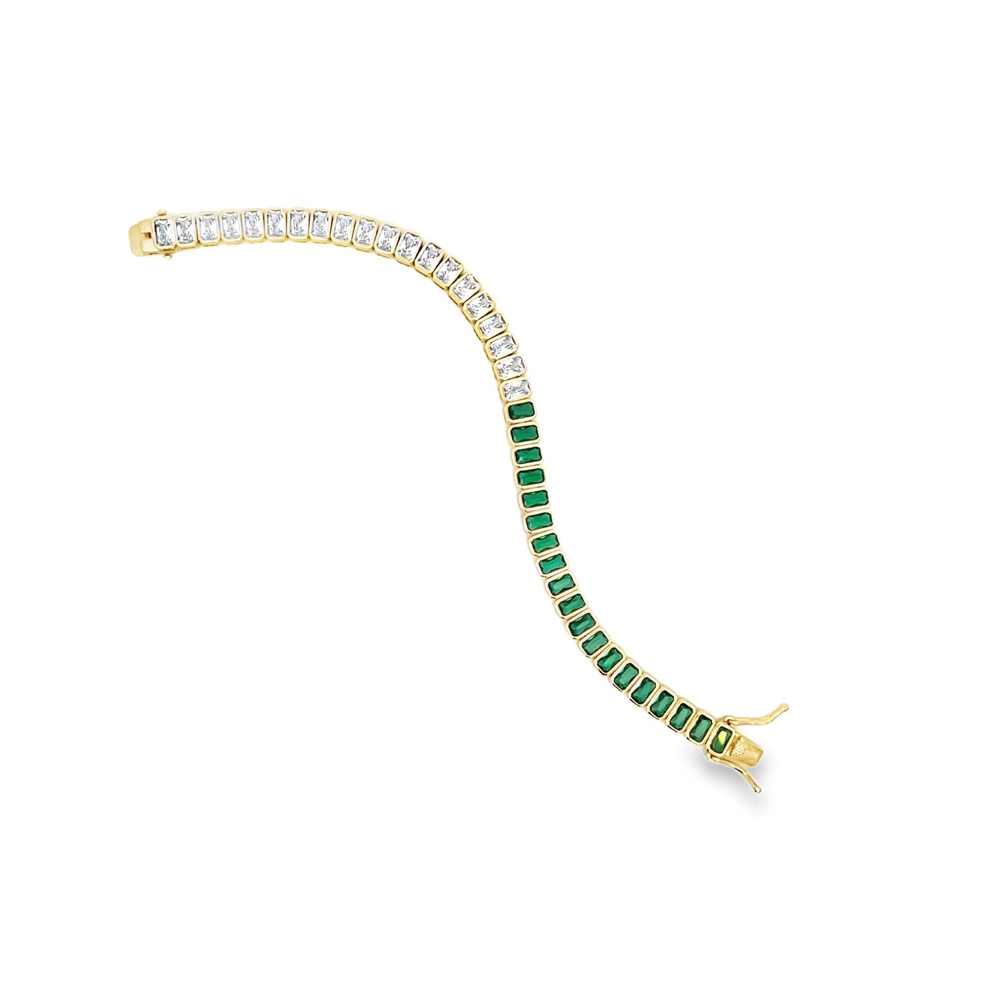 A gold tennis bracelet curves gracefully on a white background, featuring a half-strand of sparkling diamonds and a half-strand of vibrant green emerald gemstones in a prong setting.