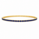 Elegant stretch tennis bracelet featuring sparkling colored CZ stones and a flexible elastic design for effortless wear. Perfect for stacking or wearing alone. Available in multiple vibrant colors including sapphire blue, emerald green, ruby red, black, and clear.