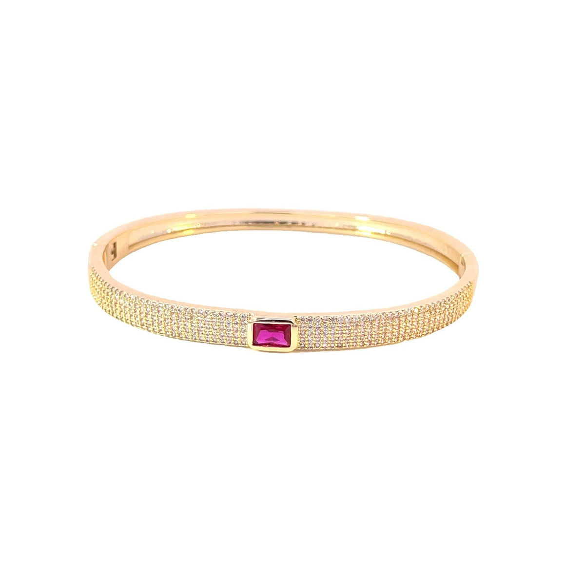 A gold pave-set diamond bangle bracelet features a vibrant rectangular pink gemstone in the center against a clean white background.