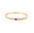 A gold pave-set diamond bangle bracelet features a vibrant rectangular pink gemstone in the center against a clean white background.