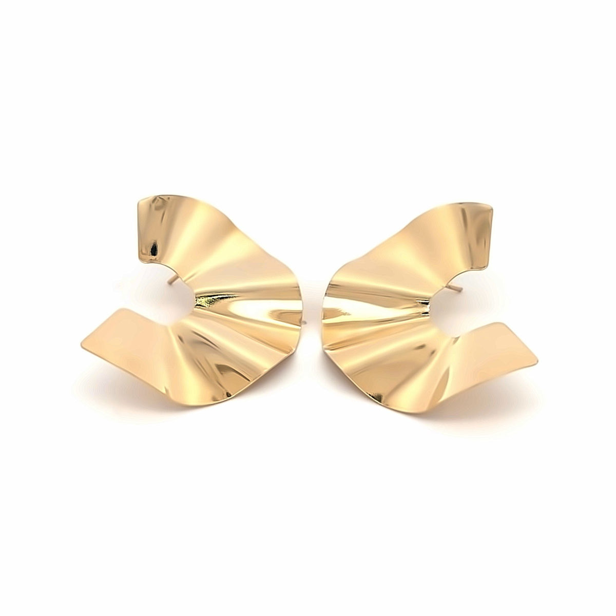 A pair of shiny gold-plated statement earrings featuring a unique, ruffled abstract design rests against a clean white background.