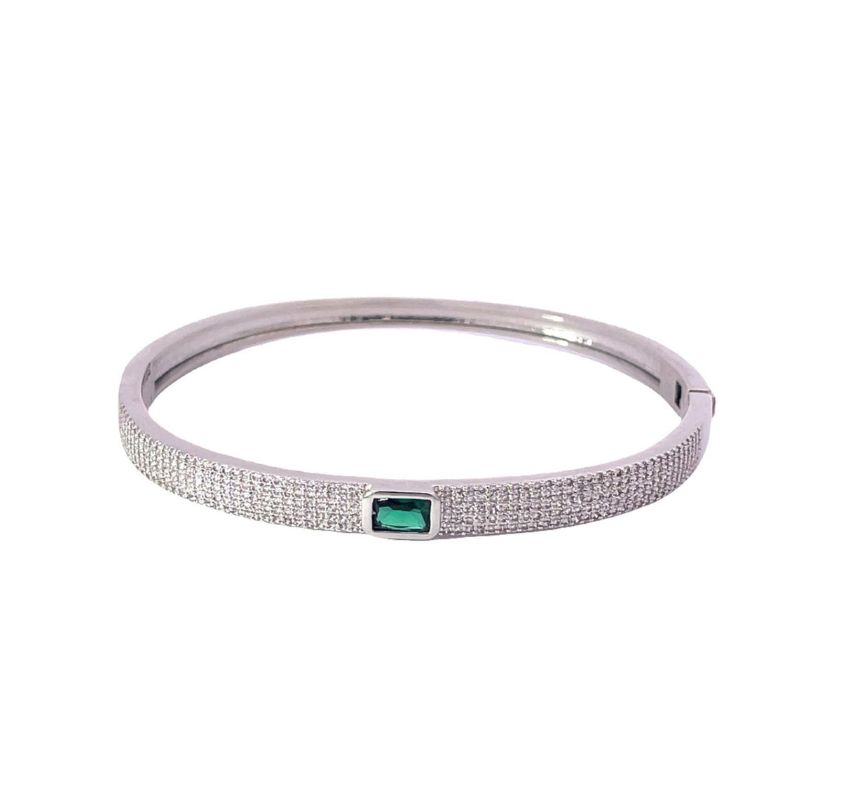 A sterling silver hinged bangle bracelet sparkles with pavé-set cubic zirconia stones and features a central emerald-cut green gemstone.
