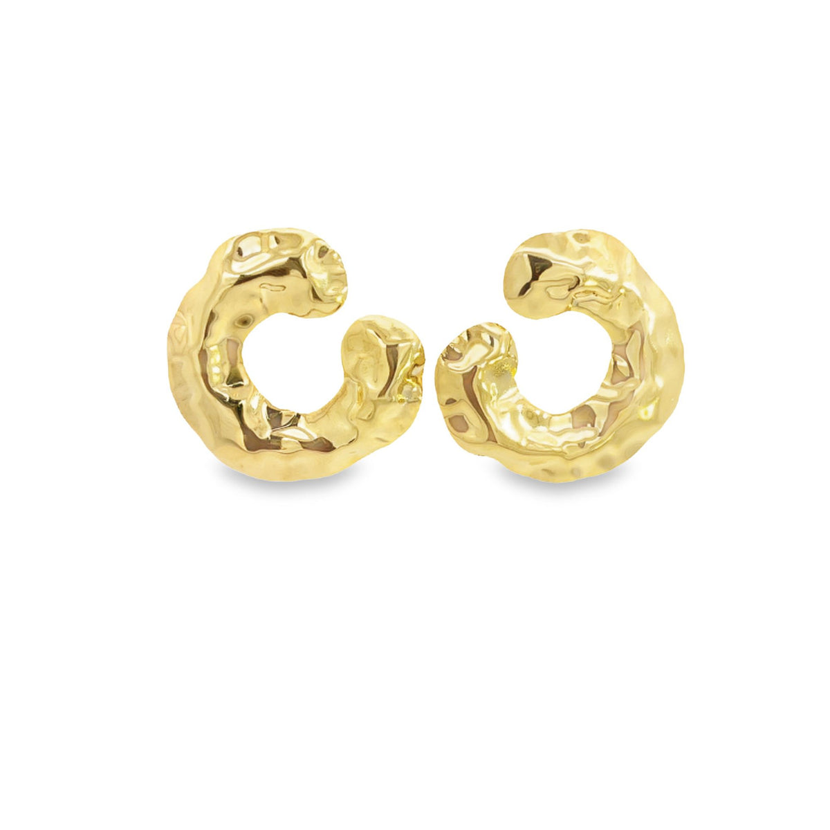 A pair of shiny gold-plated huggie hoop earrings featuring an organic, hammered texture resting side by side against a clean white background.