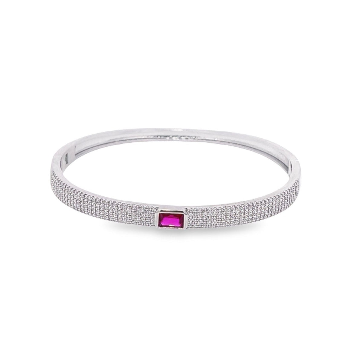 A silver pave-set diamond bangle features a vibrant rectangular pink gemstone at its center.