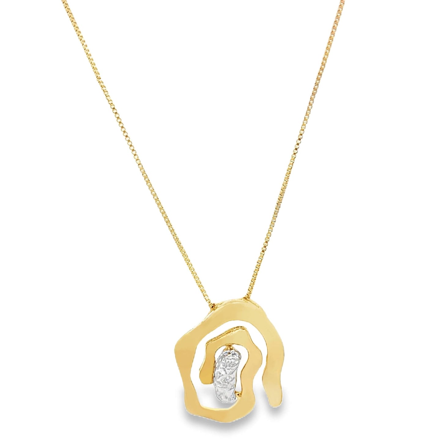A delicate gold pendant necklace features an abstract, organic-shaped charm with a sparkling diamond accent suspended on a fine chain.